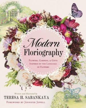 Modern Floriography front cover with the title surrounded by a wreath of flowers and a butterfly against a pink background.